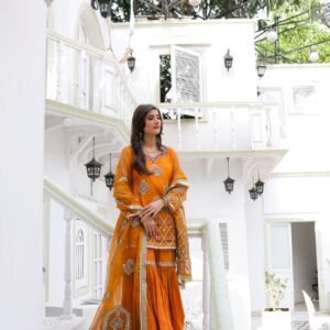 "Traditional orange bridal mehndi dress with embroidered kameez and gharara